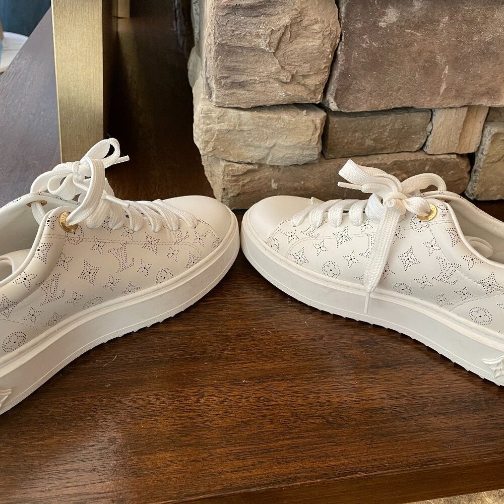 Louis Vuitton Time Out sneakers in white leather with a debossed Monogram patter